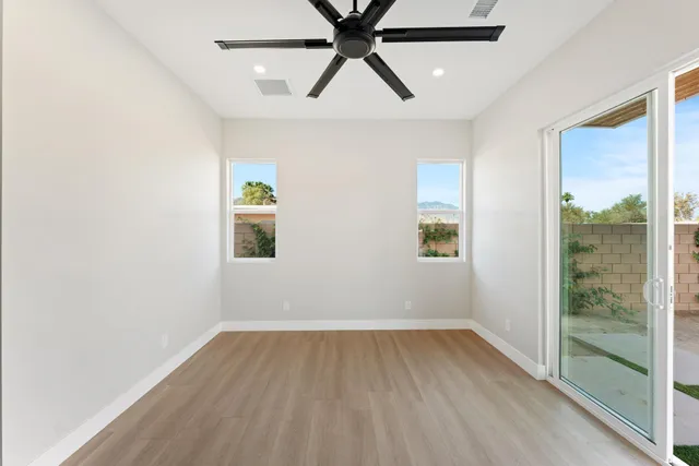 a bathroom with a double vanity sink toilet and shower