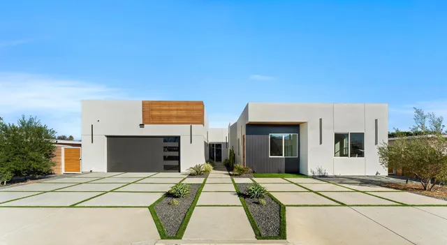 a front view of a house with yard