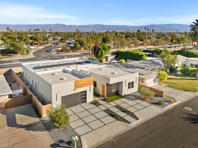 an aerial view of residential building and lake view