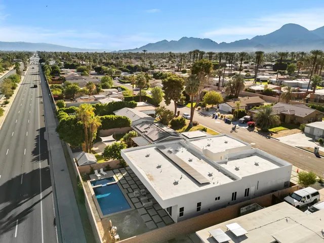an aerial view of residential building with parking space