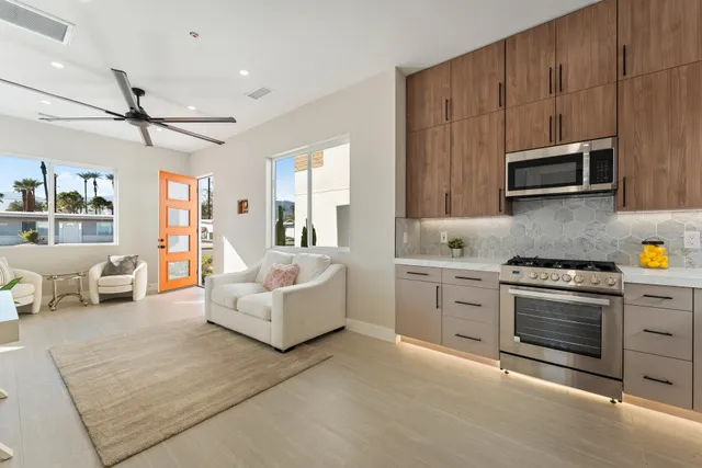 a living room with furniture and a rug