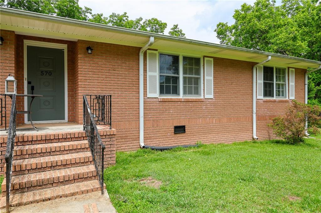 570 Wildcat Bridge Road Royston, GA 30662 - Photo 27 of 29 a front view of a house with a yard