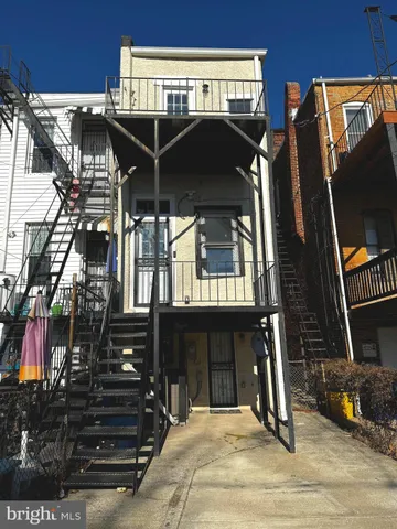a view of a balcony with chairs and floor