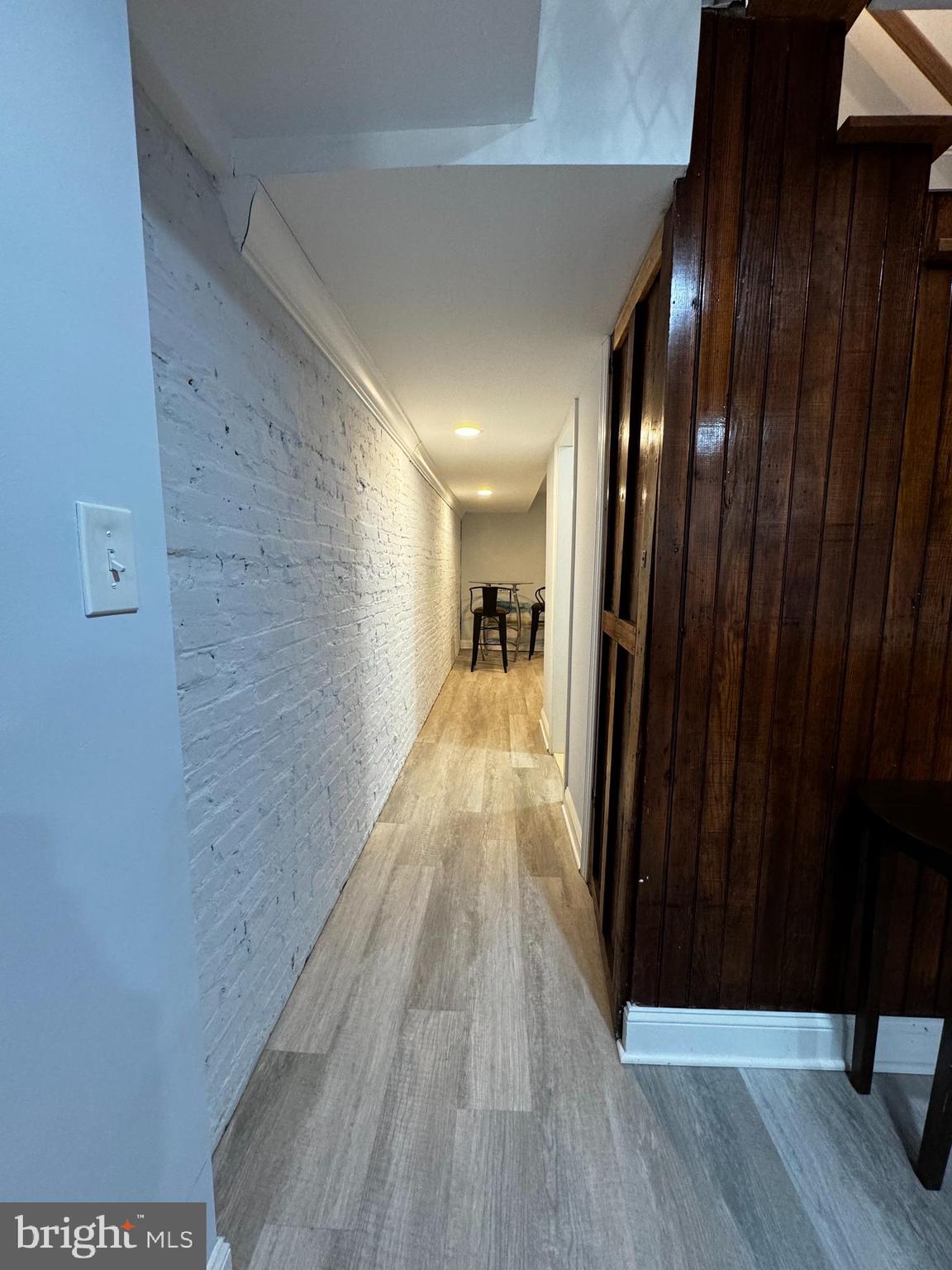 3208 Auchentoroly Terrace Baltimore, MD 21217 - Photo 13 of 25 a view of a hallway with wooden floor