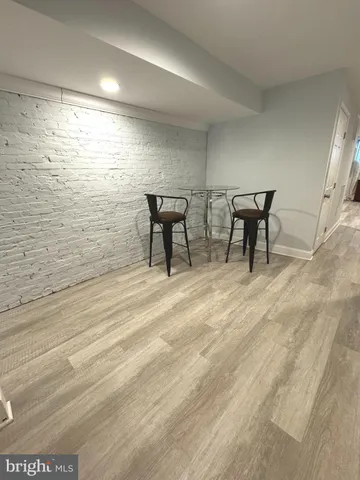 a view of a livingroom with furniture and a window