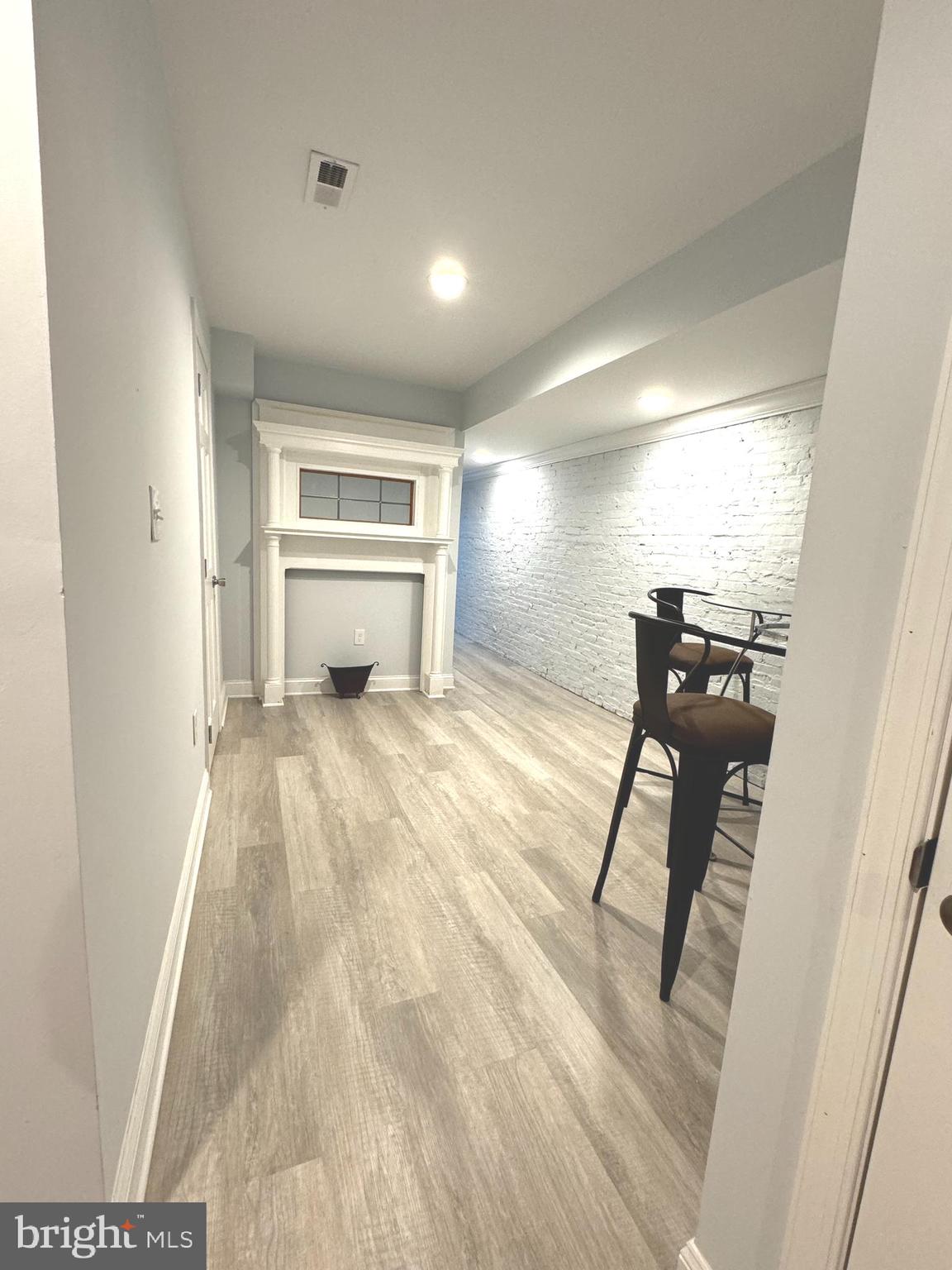 3208 Auchentoroly Terrace Baltimore, MD 21217 - Photo 17 of 25 a view of a livingroom with furniture and a window
