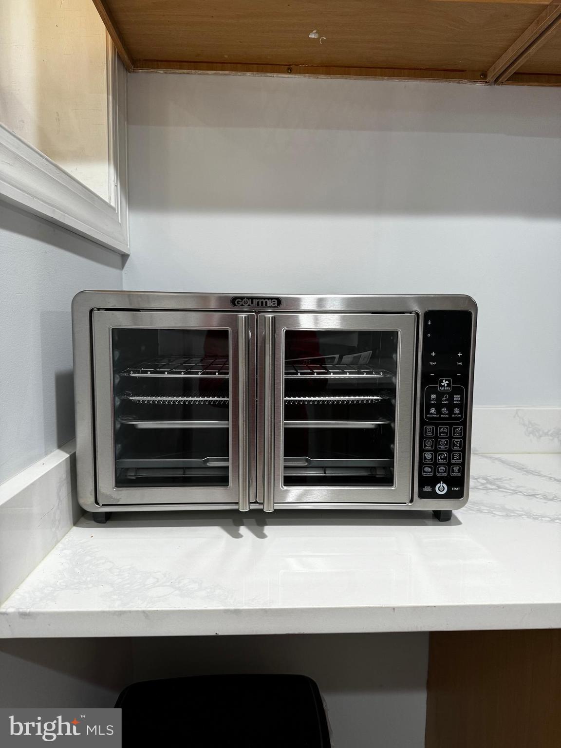3208 Auchentoroly Terrace Baltimore, MD 21217 - Photo 9 of 25 a kitchen with a stove and a microwave