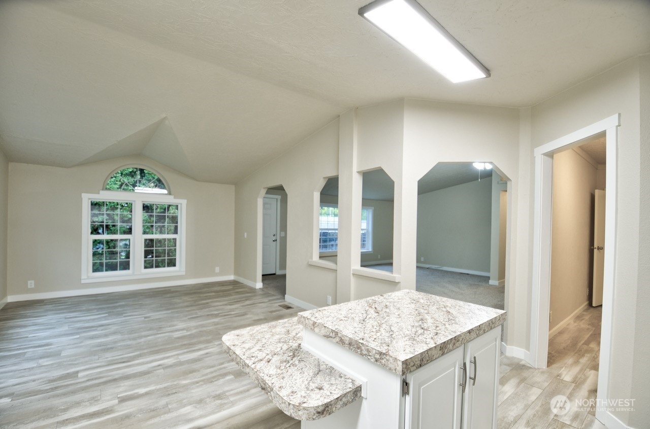 27 South Gee Creek Loop Ridgefield, WA 98642 - Photo 11 of 26 a bathroom with a granite countertop sink and a mirror