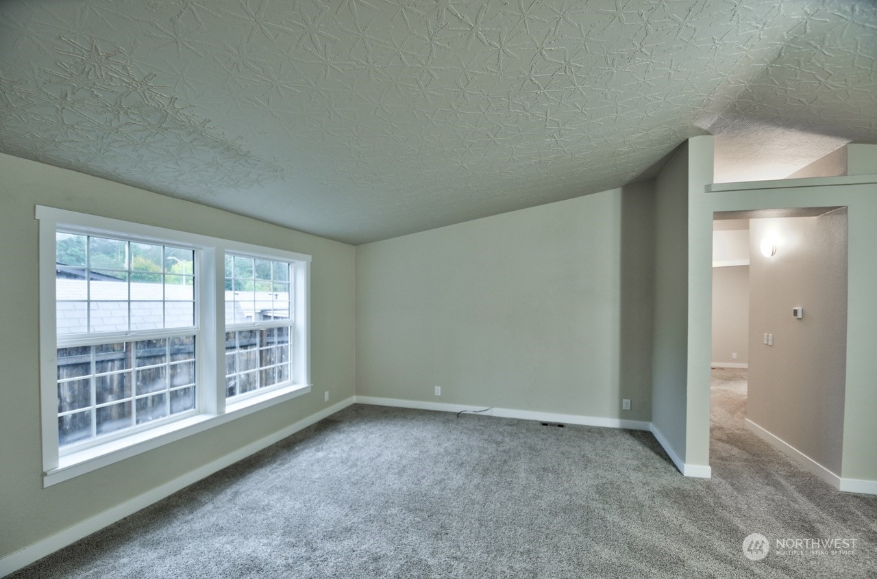 27 South Gee Creek Loop Ridgefield, WA 98642 - Photo 2 of 26 an empty room with windows