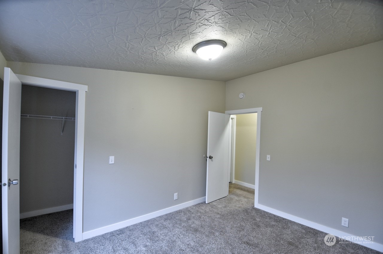 27 South Gee Creek Loop Ridgefield, WA 98642 - Photo 23 of 26 an empty room with closet area