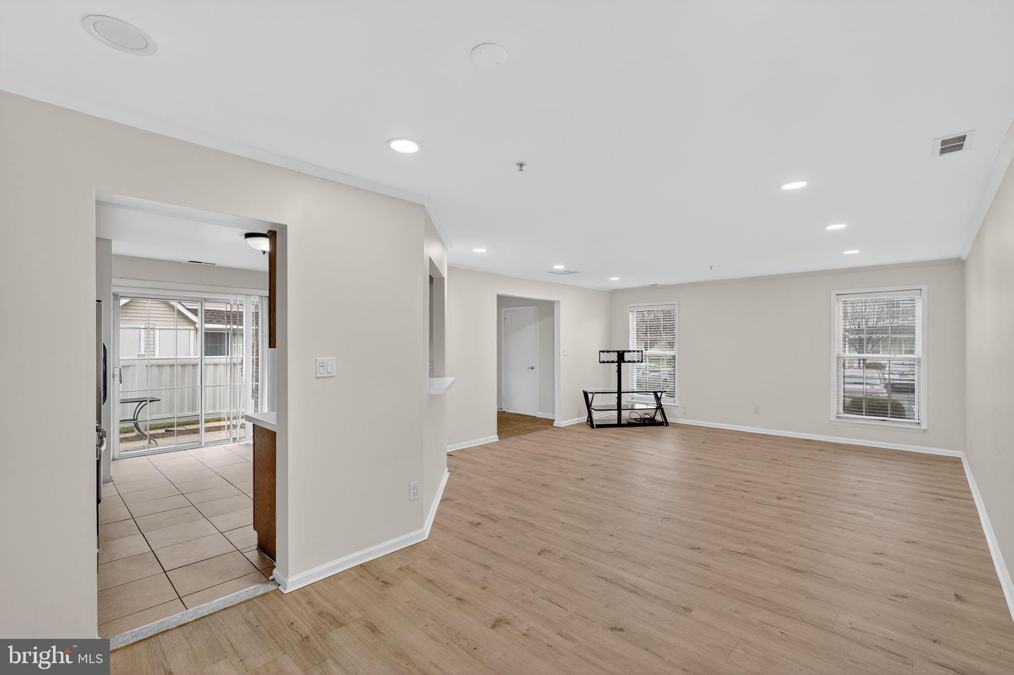 1404 Wharton Road Mount Laurel, NJ 08054 - Photo 12 of 30 a view of an empty room with wooden floor and a bathroom