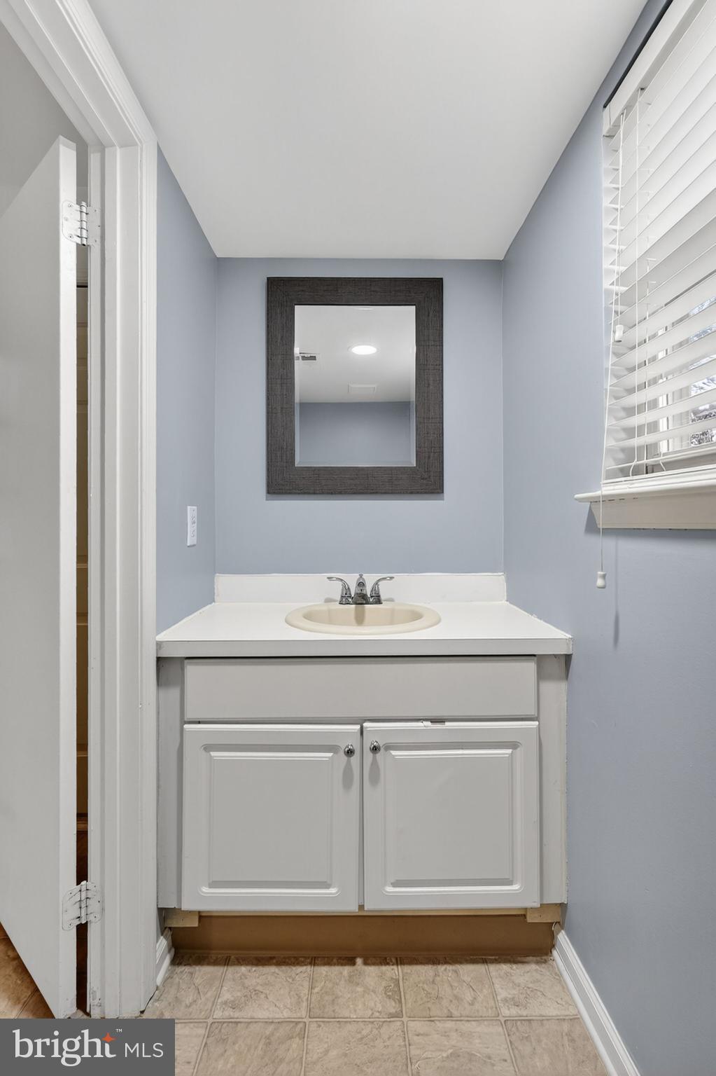 1404 Wharton Road Mount Laurel, NJ 08054 - Photo 13 of 30 a bathroom with a sink and a mirror