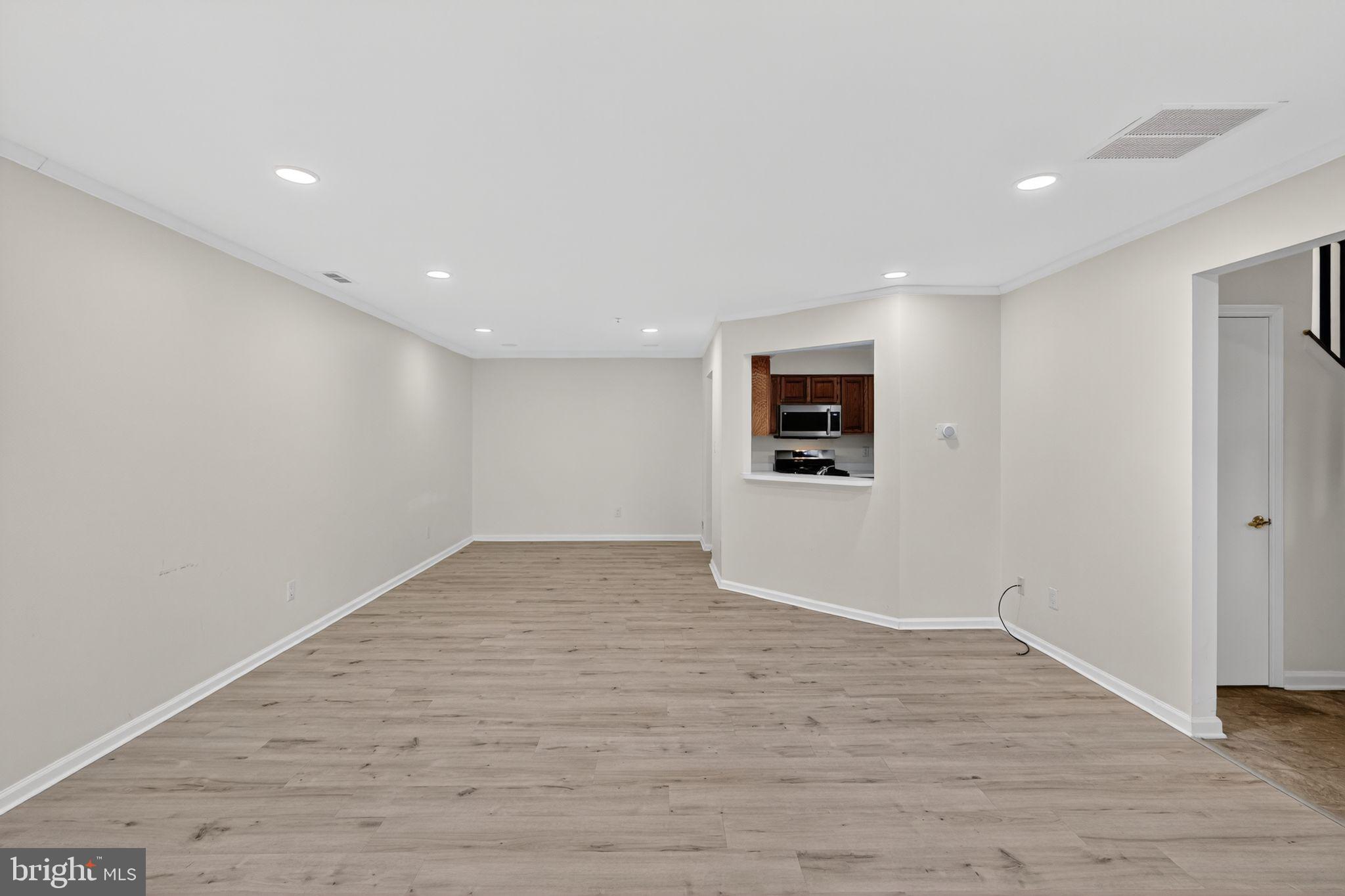 1404 Wharton Road Mount Laurel, NJ 08054 - Photo 5 of 30 a view of a big room with wooden floor and windows