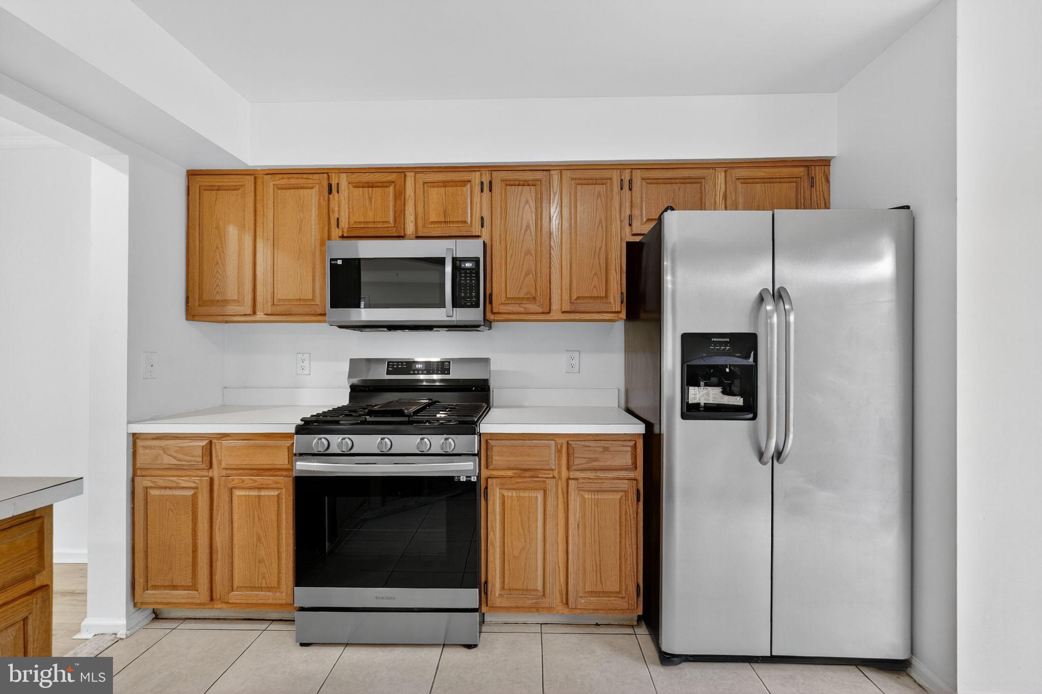 1404 Wharton Road Mount Laurel, NJ 08054 - Photo 10 of 30 a kitchen with stainless steel appliances granite countertop a refrigerator stove and microwave
