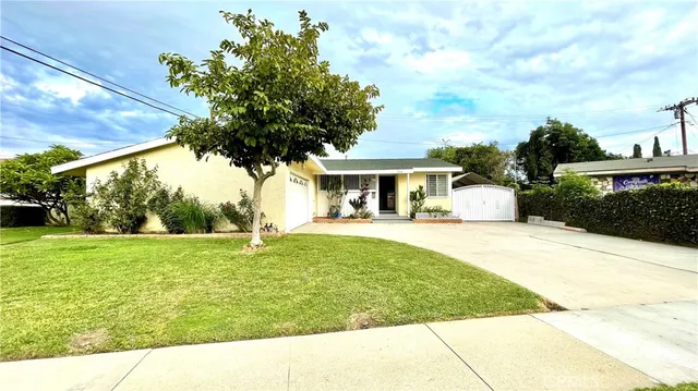 a house view with swimming pool in front of it