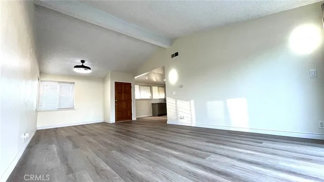 a view of a livingroom with wooden floor