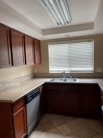 a kitchen with a sink and a window