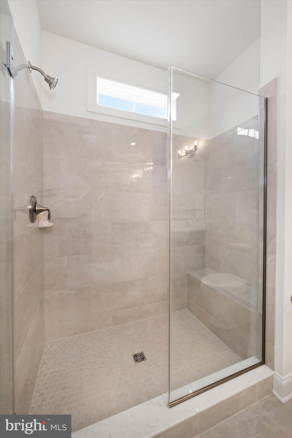 24025 Jerrico Road, Unit 38 Lincoln, DE 19960 - Photo 11 of 53 a bathroom with a glass shower door