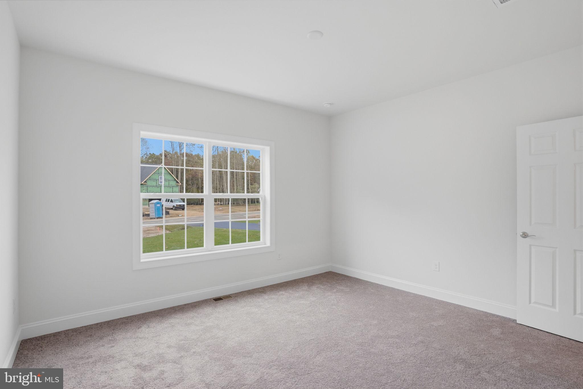 24025 Jerrico Road, Unit 38 Lincoln, DE 19960 - Photo 11 of 32 an empty room with a window