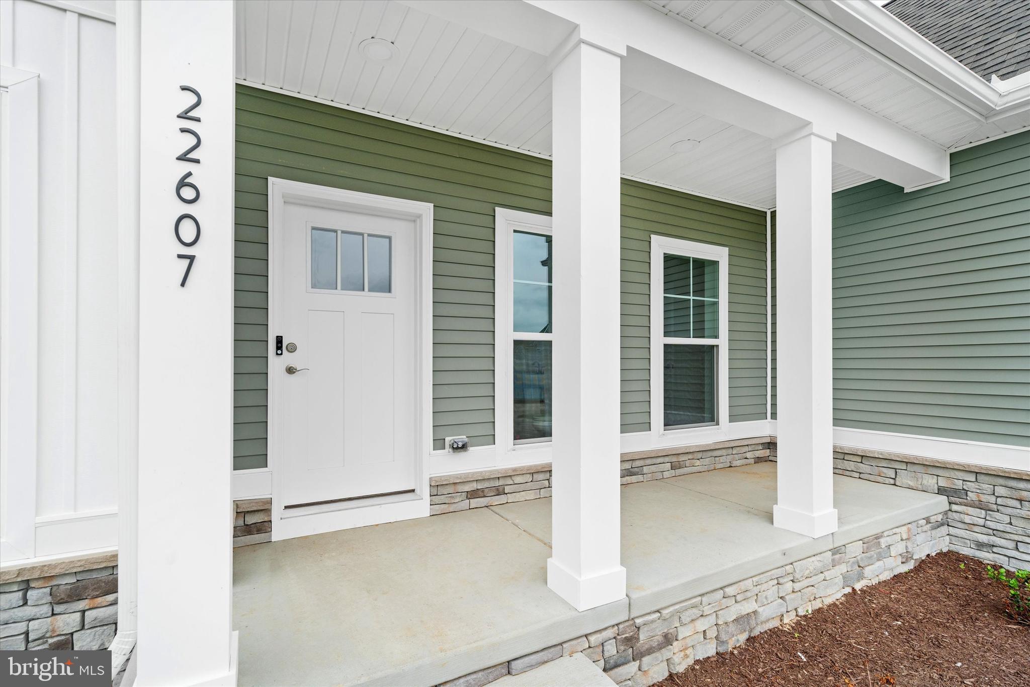 24025 Jerrico Road, Unit 38 Lincoln, DE 19960 - Photo 14 of 53 a front view of a house with a glass door