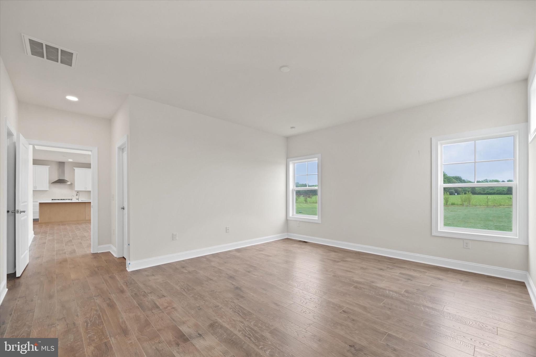24025 Jerrico Road, Unit 38 Lincoln, DE 19960 - Photo 23 of 53 an empty room with windows and entrance