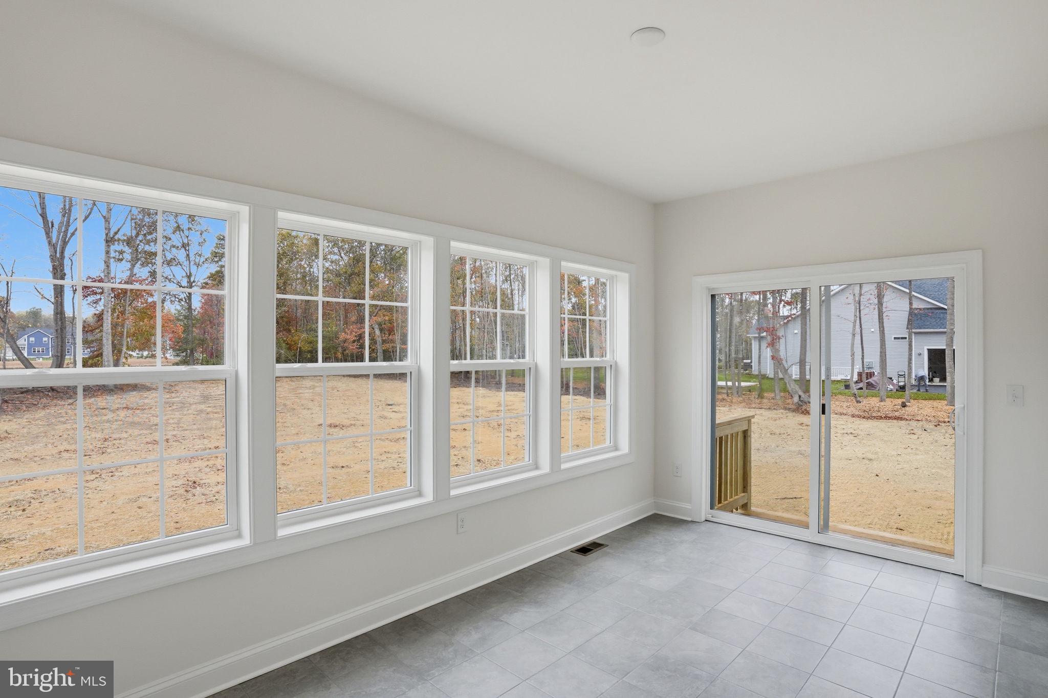 24025 Jerrico Road, Unit 38 Lincoln, DE 19960 - Photo 24 of 32 an empty room with windows