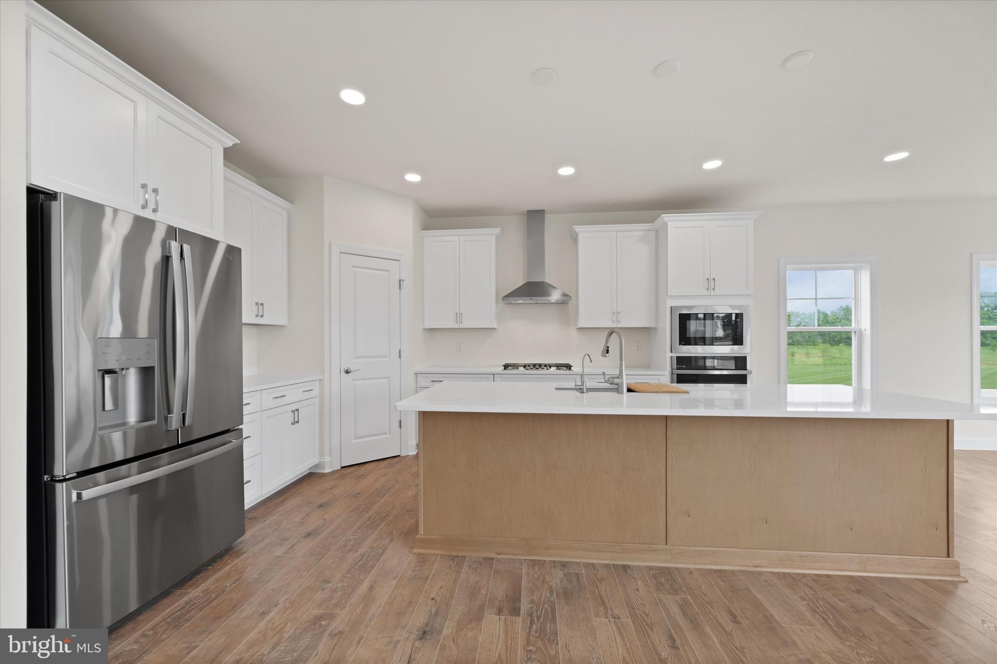 24025 Jerrico Road, Unit 38 Lincoln, DE 19960 - Photo 25 of 53 a kitchen with stainless steel appliances a refrigerator sink and microwave