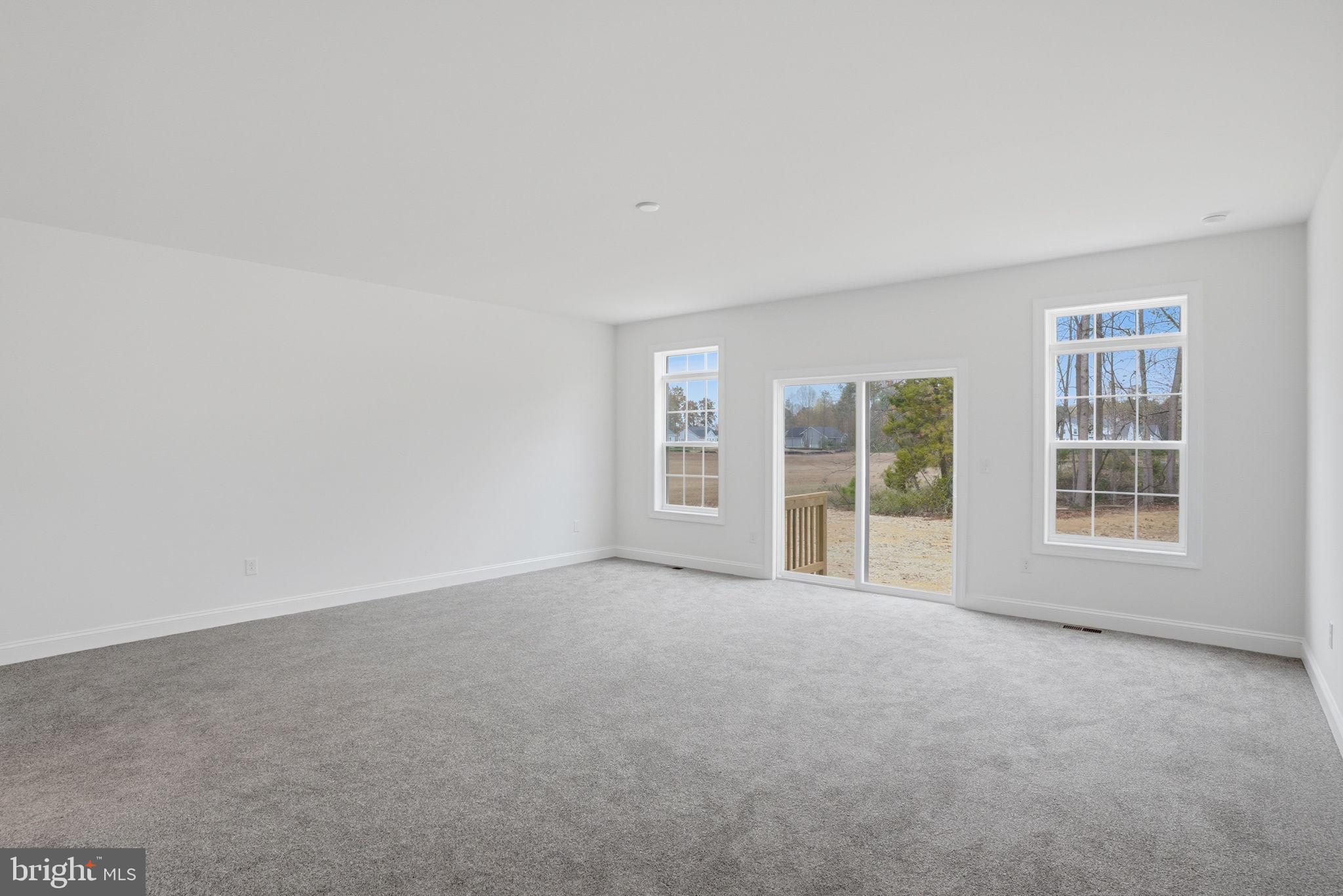 24025 Jerrico Road, Unit 38 Lincoln, DE 19960 - Photo 26 of 32 an empty room with windows