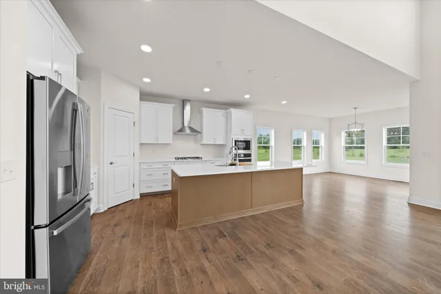 a view of a kitchen with a sink and a stove top oven
