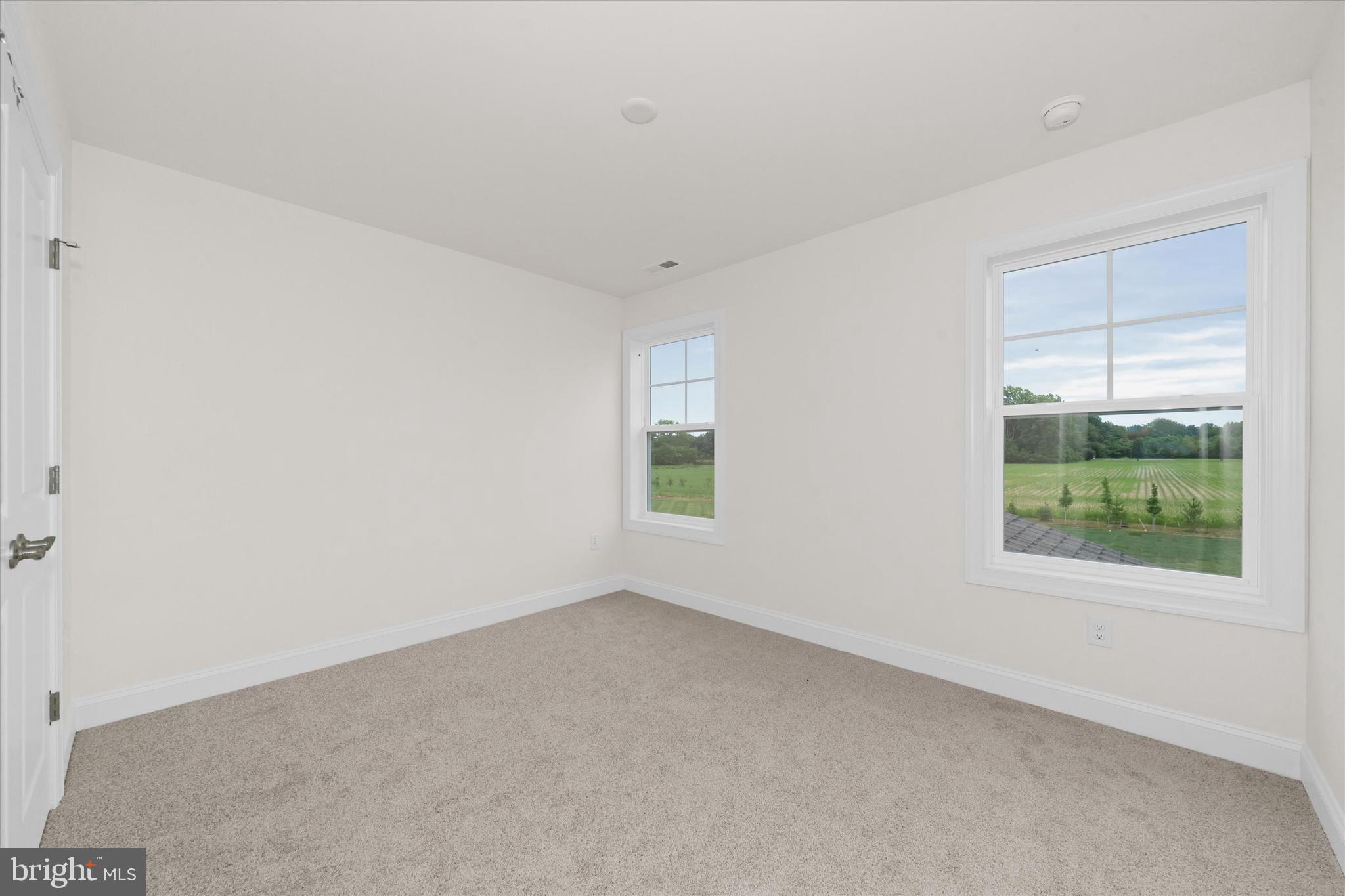 24025 Jerrico Road, Unit 38 Lincoln, DE 19960 - Photo 32 of 53 an empty room with windows