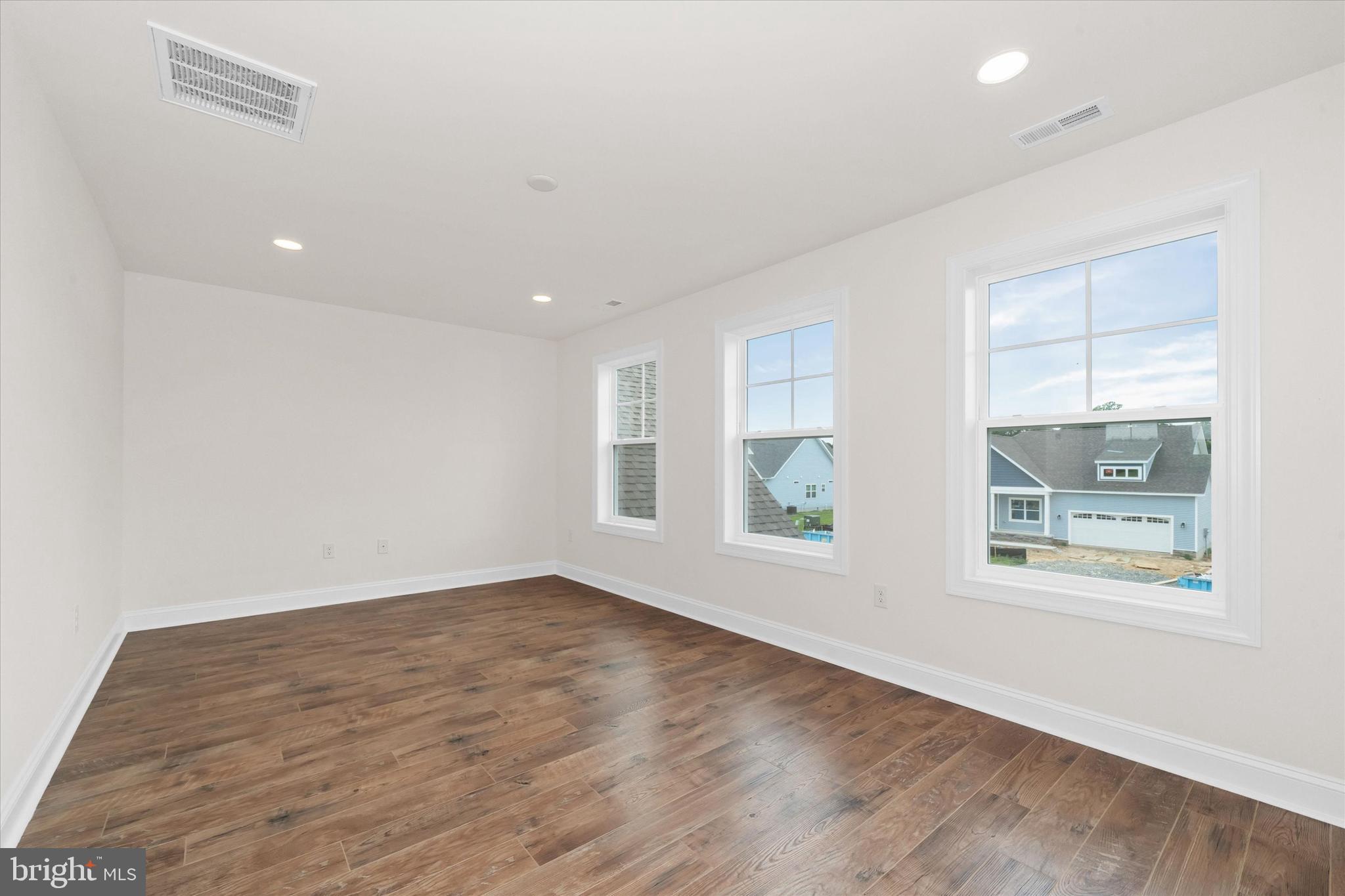 24025 Jerrico Road, Unit 38 Lincoln, DE 19960 - Photo 38 of 53 wooden floor in an empty room with a window