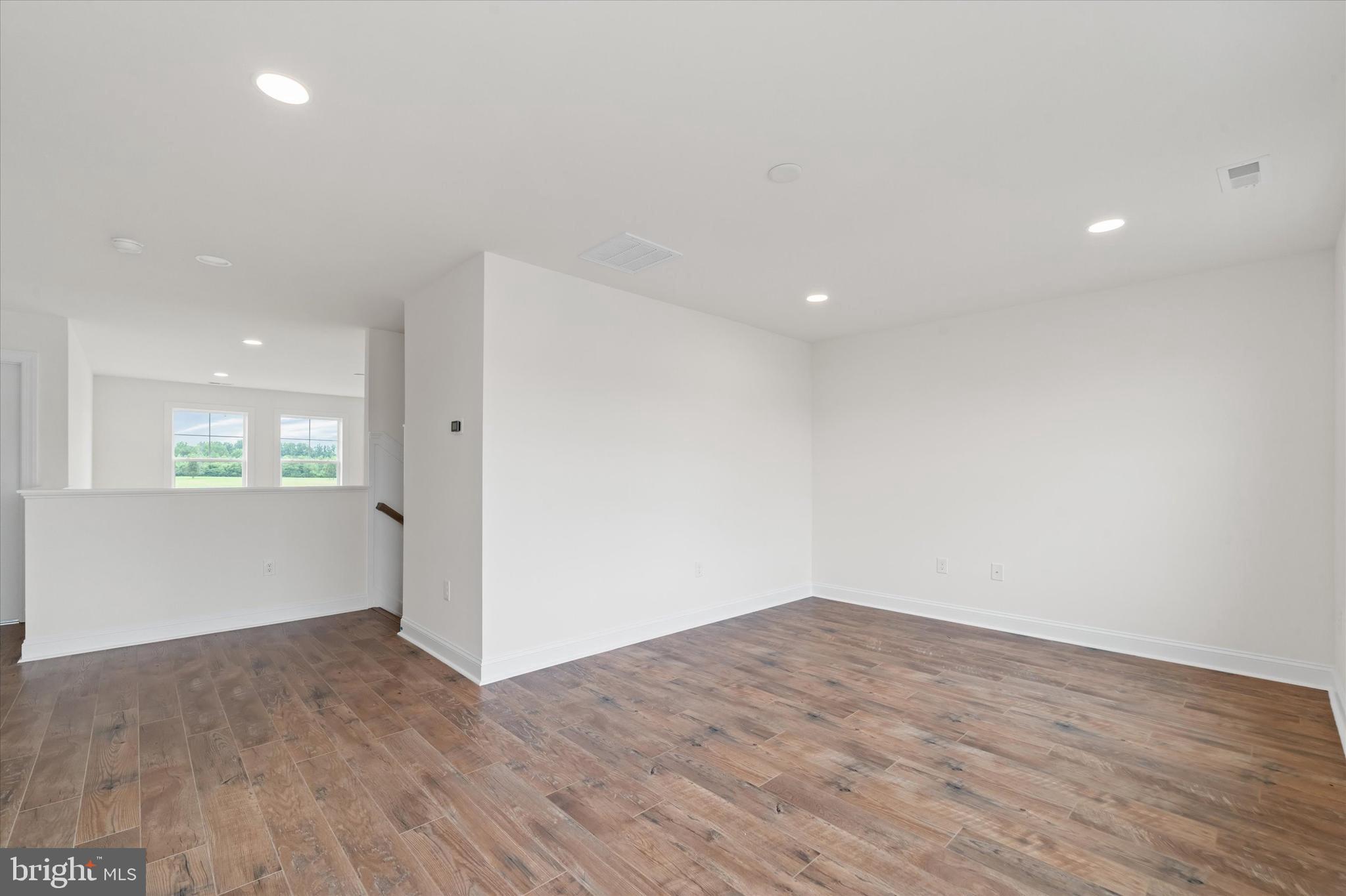 24025 Jerrico Road, Unit 38 Lincoln, DE 19960 - Photo 39 of 53 a view of empty room with wooden floor and fan