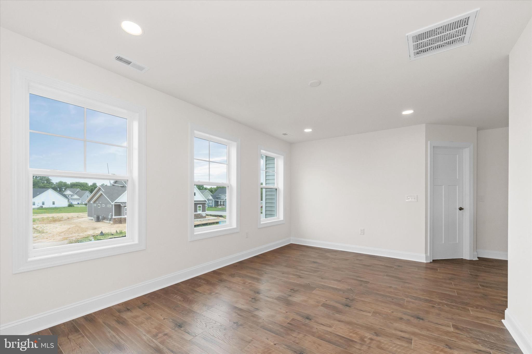 24025 Jerrico Road, Unit 38 Lincoln, DE 19960 - Photo 40 of 53 wooden floor in an empty room with a window