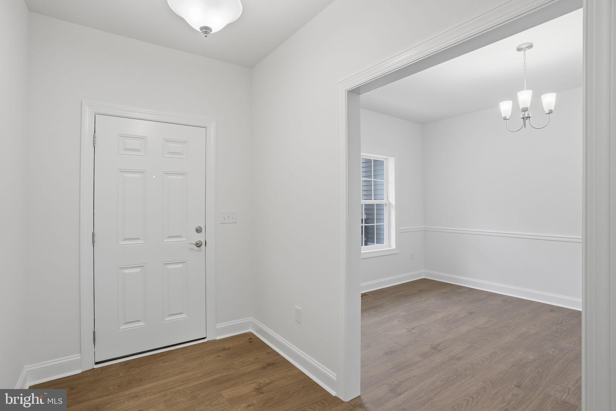 24025 Jerrico Road, Unit 38 Lincoln, DE 19960 - Photo 4 of 32 a view of empty room with wooden floor and fan