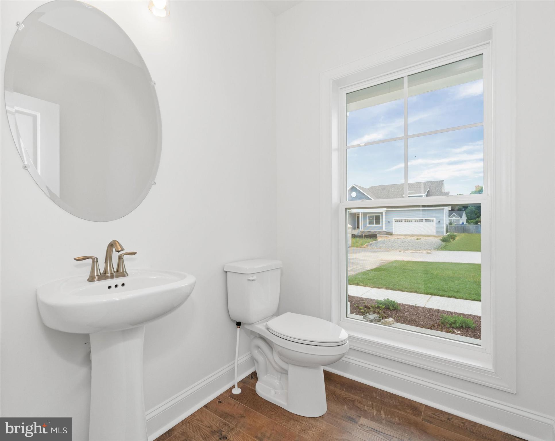 24025 Jerrico Road, Unit 38 Lincoln, DE 19960 - Photo 43 of 53 a bathroom with a sink toilet and shower
