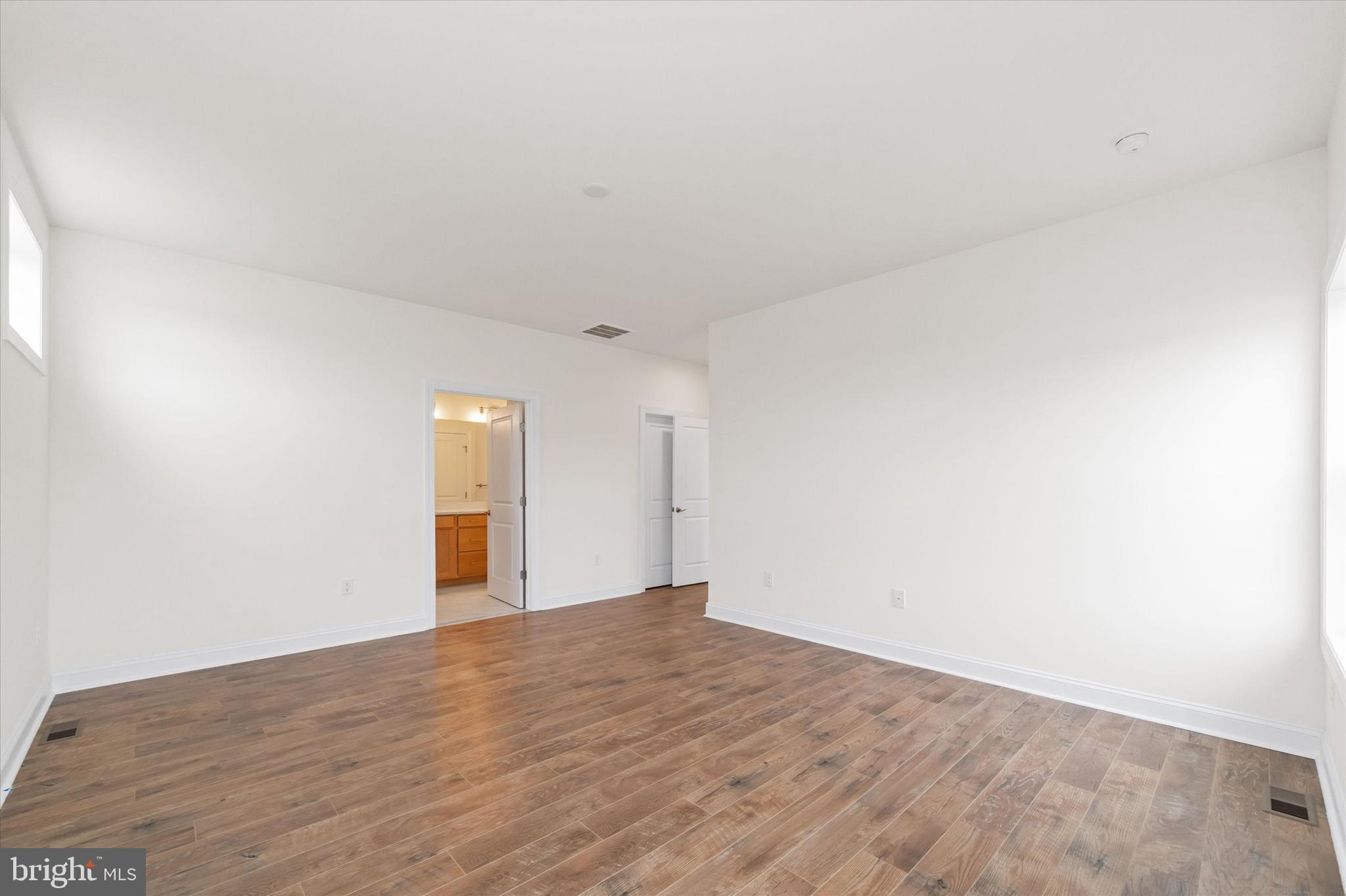 24025 Jerrico Road, Unit 38 Lincoln, DE 19960 - Photo 50 of 53 a view of empty room with wooden floor