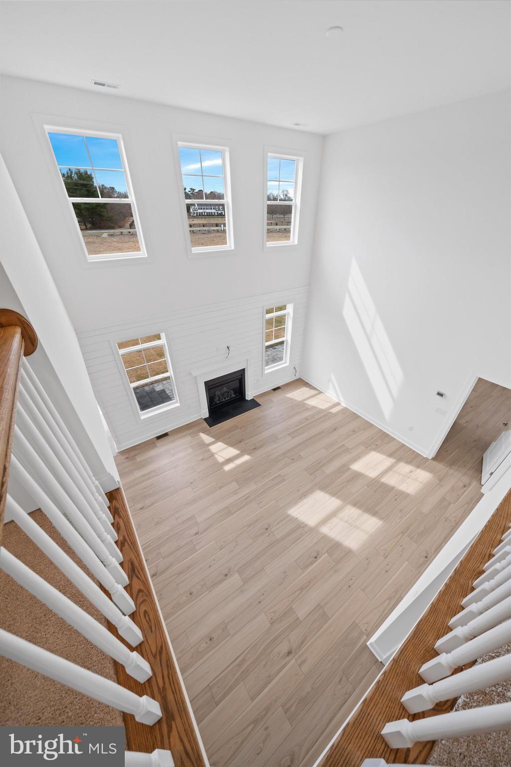 24025 Jerrico Road, Unit 38 Lincoln, DE 19960 - Photo 5 of 53 a view of wooden floor and windows in a room