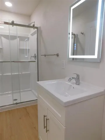 a bathroom with a sink and a mirror