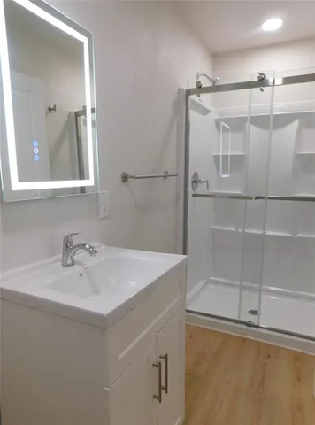 a front view of a house with a garden and yard