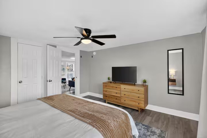 1401 Collier Street Houston, TX 77023 - Photo 13 of 18 a bedroom with a bed and a flat screen tv