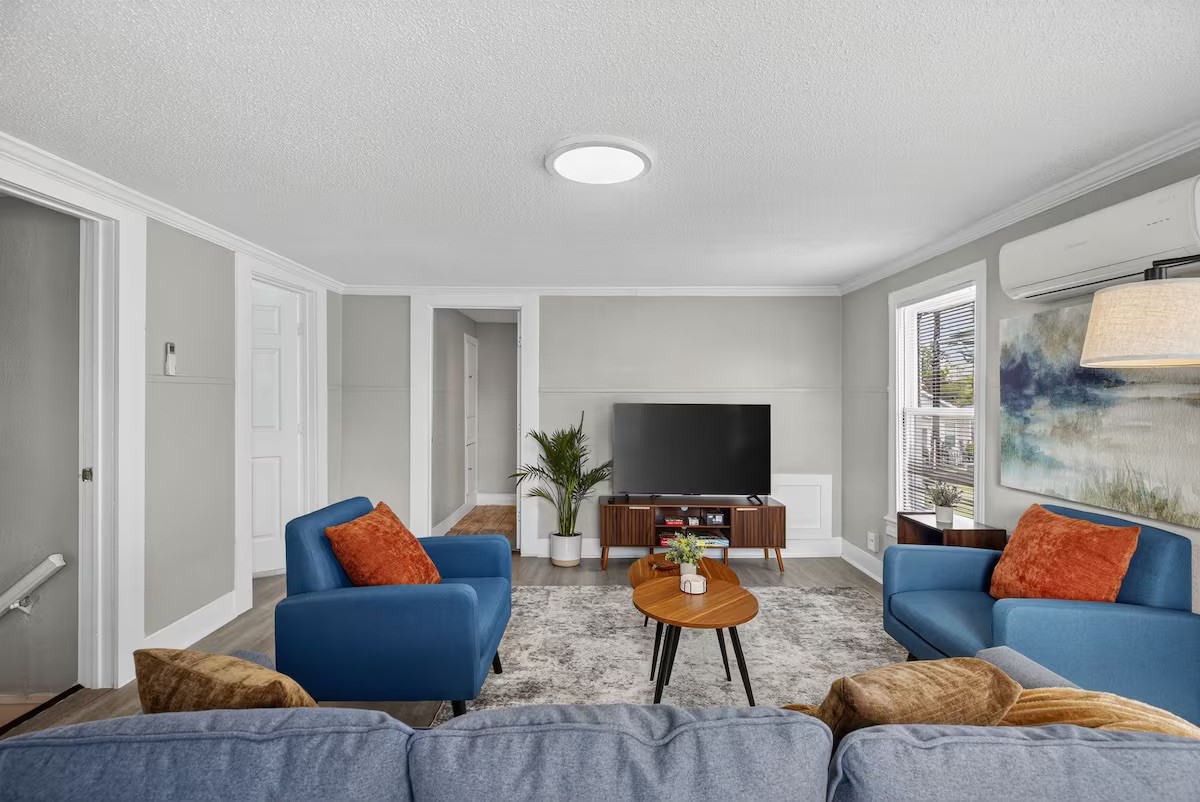 1401 Collier Street Houston, TX 77023 - Photo 5 of 18 a living room with furniture and a flat screen tv