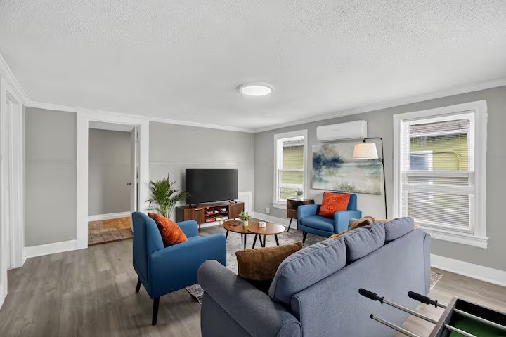 1401 Collier Street Houston, TX 77023 - Photo 6 of 18 a living room with furniture and a flat screen tv