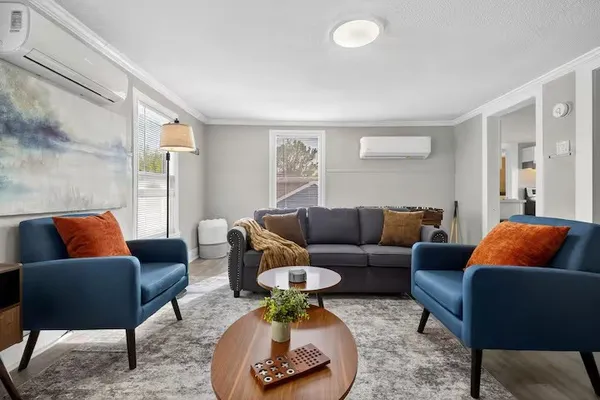 a living room with furniture and a couch