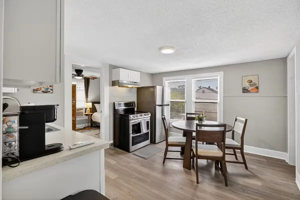 a view of a dining room with furniture and a fireplace
