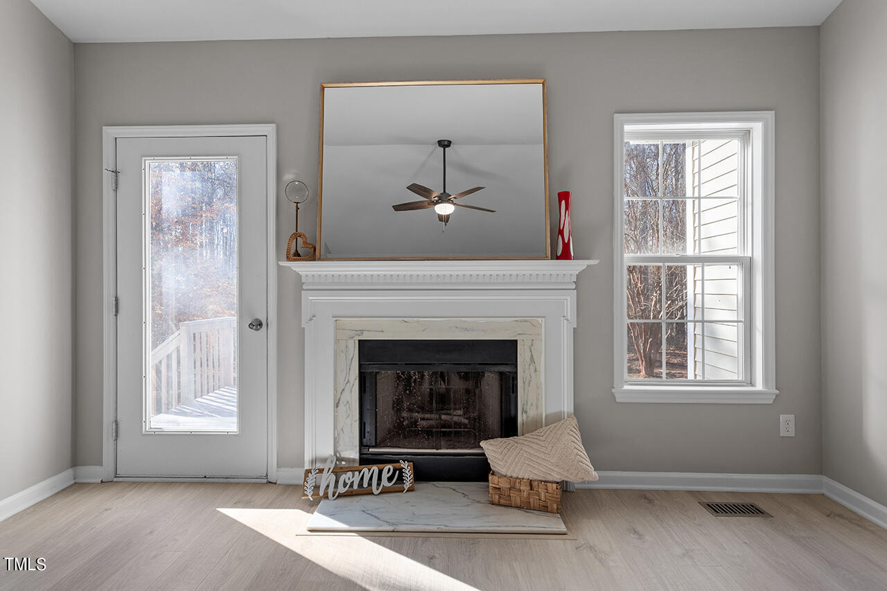 5404 Passenger Place Raleigh, NC 27603 - Photo 14 of 25 a living room with furniture and a fireplace