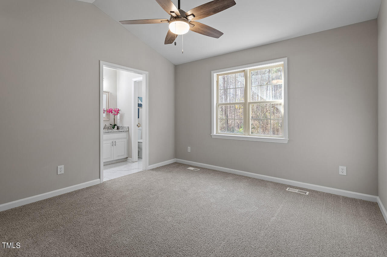 5404 Passenger Place Raleigh, NC 27603 - Photo 16 of 25 a view of an empty room with a window