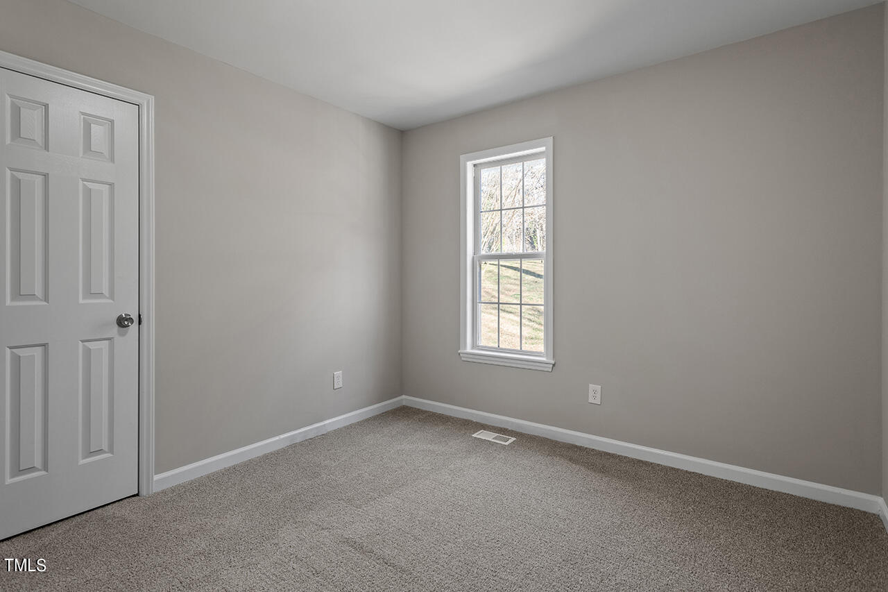 5404 Passenger Place Raleigh, NC 27603 - Photo 21 of 25 an empty room with windows