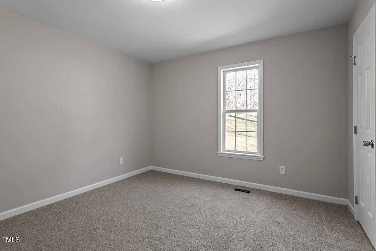 5404 Passenger Place Raleigh, NC 27603 - Photo 23 of 25 an empty room with a window
