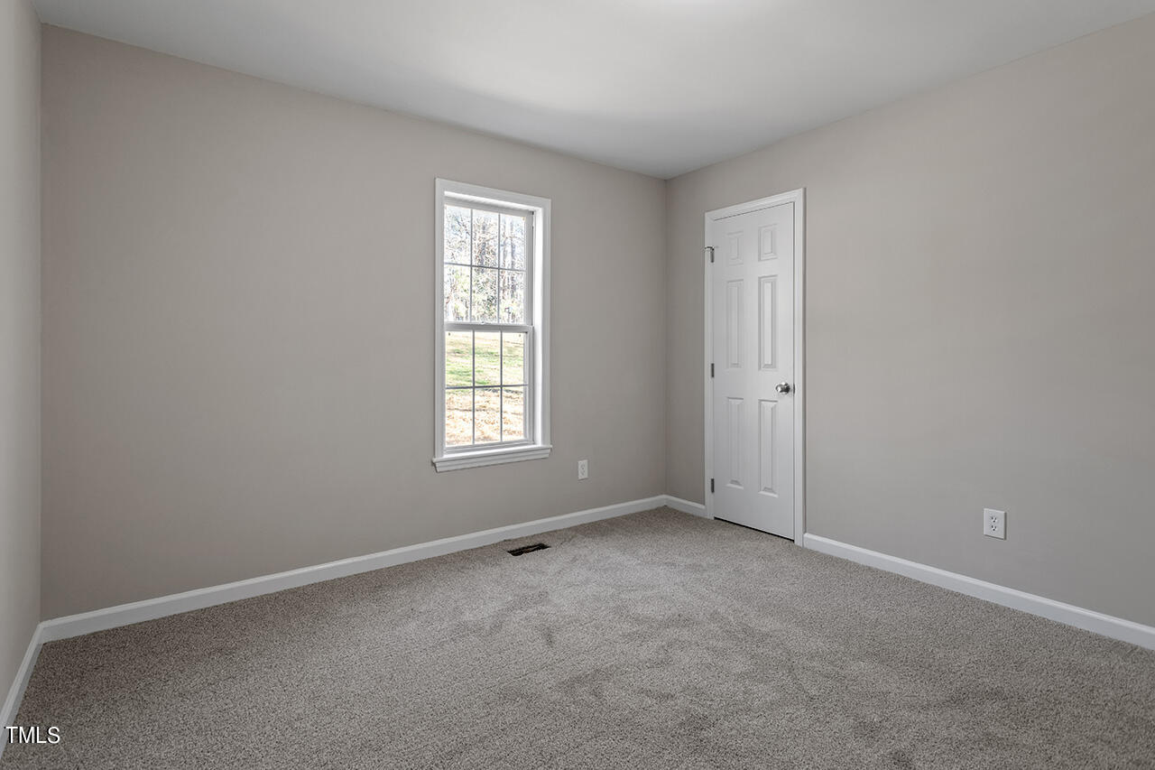 5404 Passenger Place Raleigh, NC 27603 - Photo 24 of 25 an empty room with windows