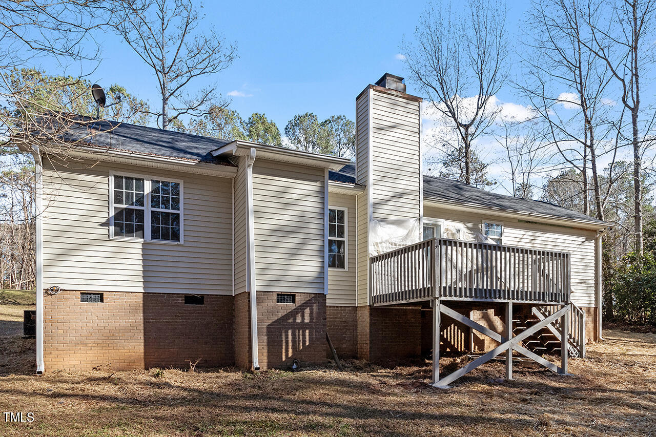 5404 Passenger Place Raleigh, NC 27603 - Photo 25 of 25 a view of a patio with table and chairs with wooden floor and fence